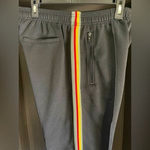Urban Outfitters Men’s Track Pants. Black with green/yellow/red side stripes. L
